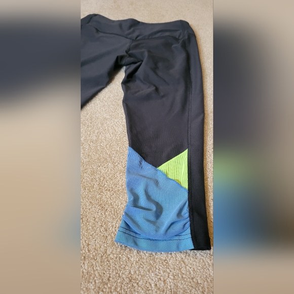 Nike dri-fit womens medium capris black with neon green & blue sheer on back of - Picture 5 of 12